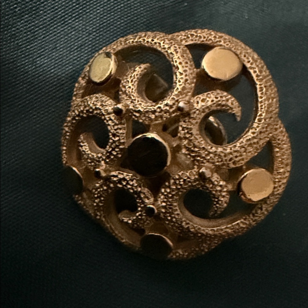 Single Crown Trifari clip on gold tone earring